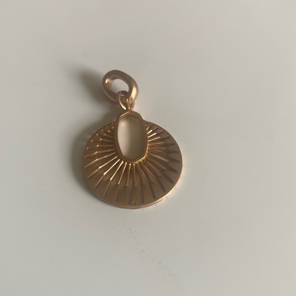 Kendra Scott Charm in Rose Gold.